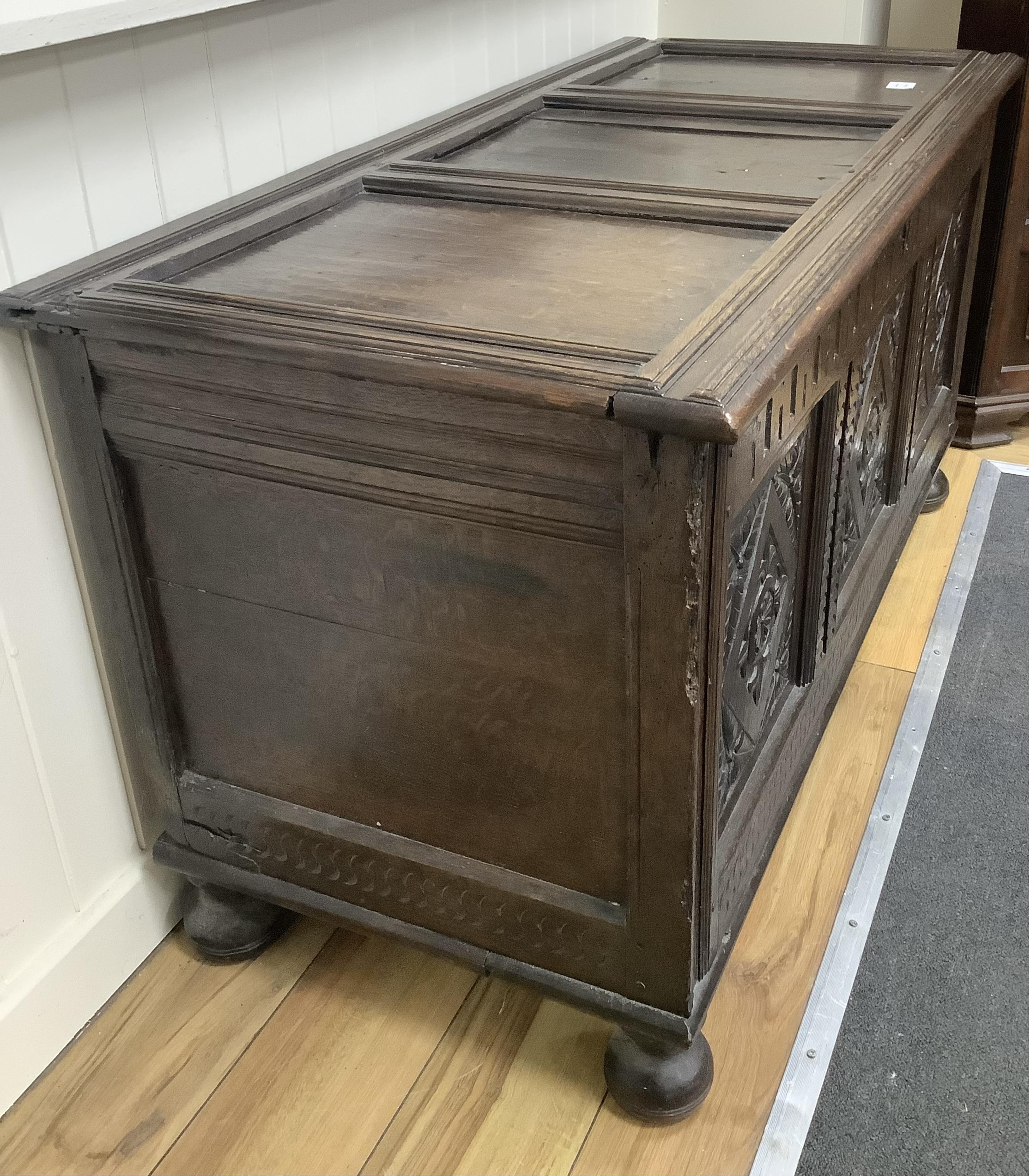 A 17th century and later carved oak coffer, width 128cm, depth 58cm, height 68cm. Condition -fair